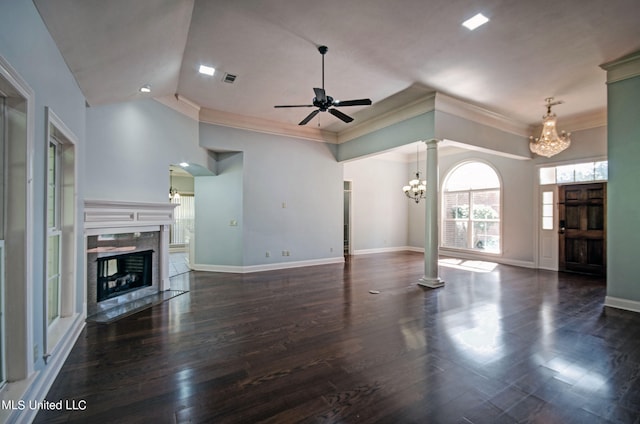 unfurnished living room with dark hardwood / wood-style floors, ornate columns, and a high end fireplace