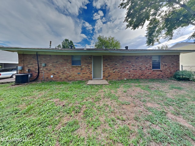 6525 Yorkshire Rd, Horn Lake, MS 38637 - rear view of house with brick siding and central AC unit