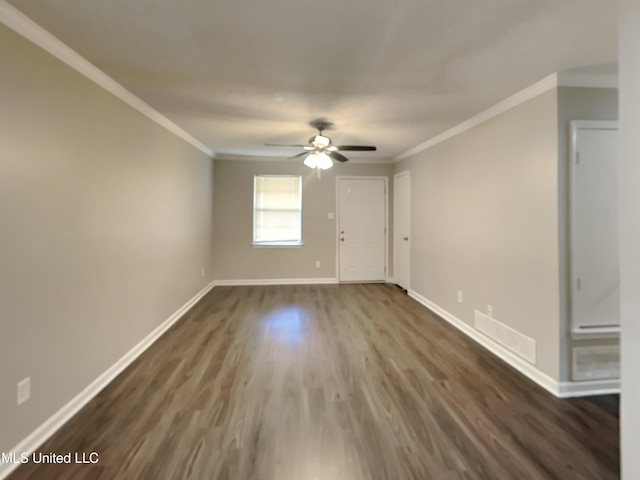 6525 Yorkshire Rd, Horn Lake, MS 38637 - unfurnished room with crown molding, dark wood-type flooring, baseboards, and a ceiling fan