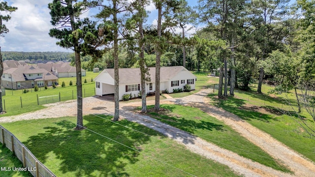 8279 Dunn Ln, Olive Branch, MS 38654 - single story home featuring dirt driveway, a garage, view of wooded area, and a residential view