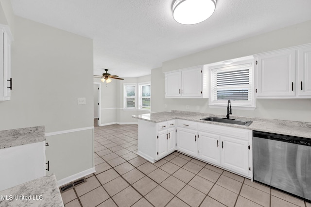 8279 Dunn Ln, Olive Branch, MS 38654 - kitchen with dishwasher, light tile patterned flooring, white cabinets, a ceiling fan, and a textured ceiling