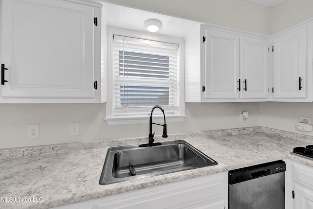8279 Dunn Ln, Olive Branch, MS 38654 - kitchen with dishwasher, white cabinets, and light countertops