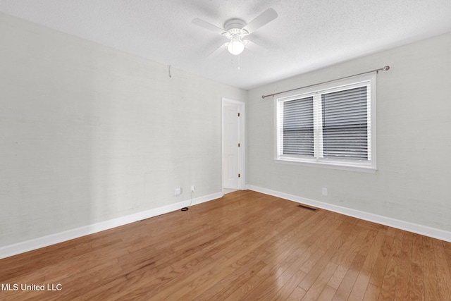 8279 Dunn Ln, Olive Branch, MS 38654 - empty room featuring wood finished floors, a ceiling fan, and a textured ceiling