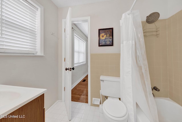 8279 Dunn Ln, Olive Branch, MS 38654 - full bathroom with shower / bath combination with curtain, vanity, tile patterned flooring, tile walls, and wainscoting