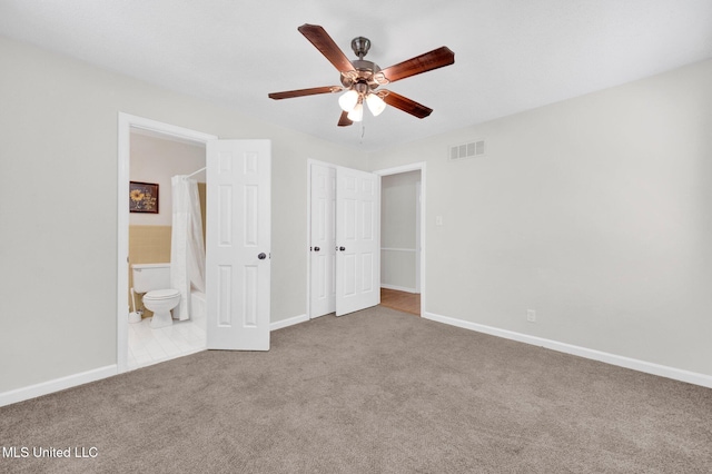 8279 Dunn Ln, Olive Branch, MS 38654 - unfurnished bedroom featuring carpet flooring, connected bathroom, and a ceiling fan