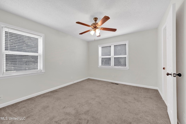 8279 Dunn Ln, Olive Branch, MS 38654 - empty room with carpet floors, a ceiling fan, and a textured ceiling
