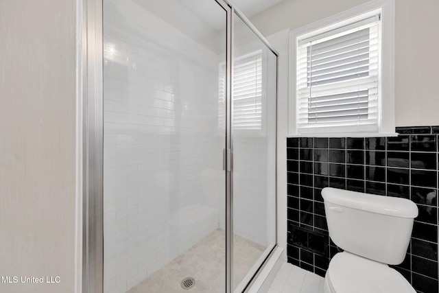 8279 Dunn Ln, Olive Branch, MS 38654 - bathroom featuring a shower stall and tile walls