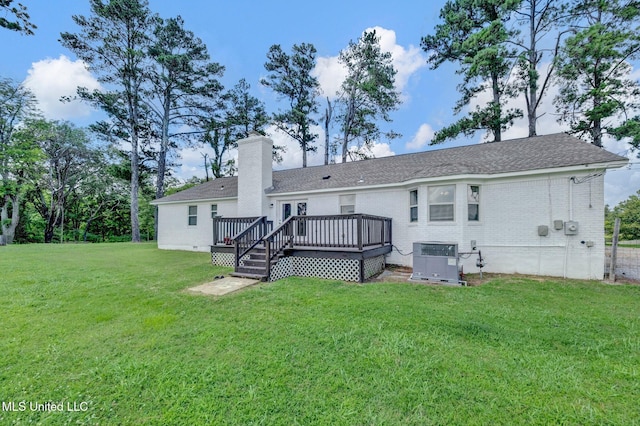 8279 Dunn Ln, Olive Branch, MS 38654 - rear view of property featuring a deck, a yard, brick siding, a chimney, and a shingled roof