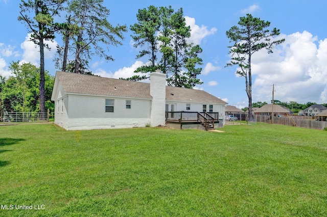 8279 Dunn Ln, Olive Branch, MS 38654 - back of house featuring a deck, a fenced backyard, a chimney, and brick siding