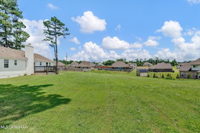 8279 Dunn Ln, Olive Branch, MS 38654 - view of yard with a residential view, a deck, and a shed