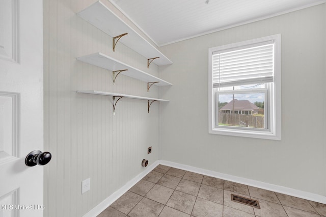 8279 Dunn Ln, Olive Branch, MS 38654 - washroom featuring hookup for an electric dryer and light tile patterned flooring