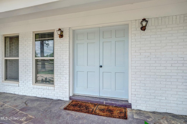 8279 Dunn Ln, Olive Branch, MS 38654 - entrance to property featuring brick siding and covered porch