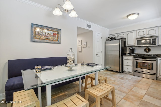 dining room with an inviting chandelier, visible vents, crown molding, and light tile patterned flooring