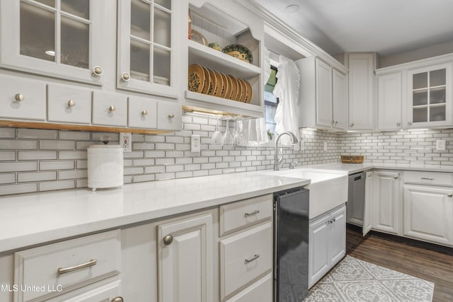 kitchen featuring decorative backsplash, white cabinetry, dark wood-style flooring, and glass insert cabinets