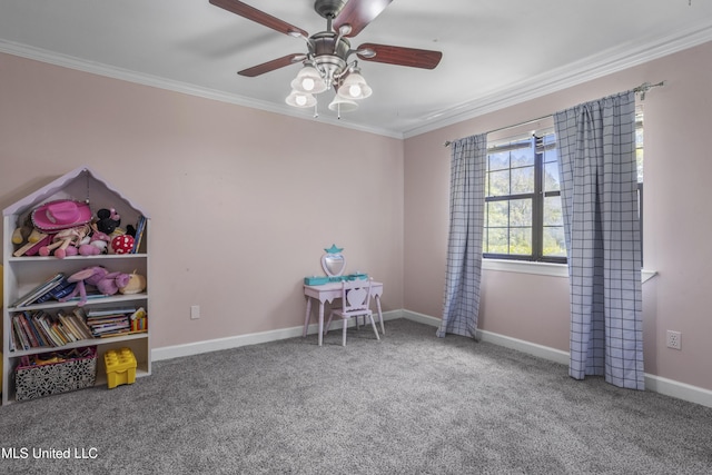 recreation room featuring crown molding, a ceiling fan, carpet, and baseboards