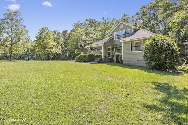 exterior space featuring crawl space, central AC, roof with shingles, and a front lawn