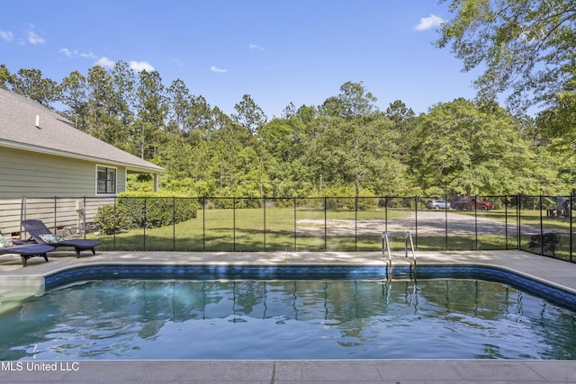 view of pool with a fenced in pool and fence