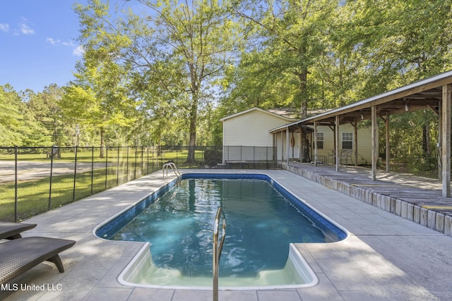 view of swimming pool with a fenced in pool, fence, and a patio area