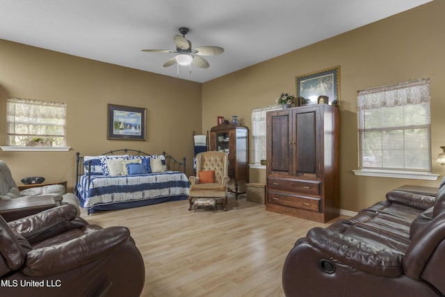 bedroom featuring a ceiling fan and light wood finished floors
