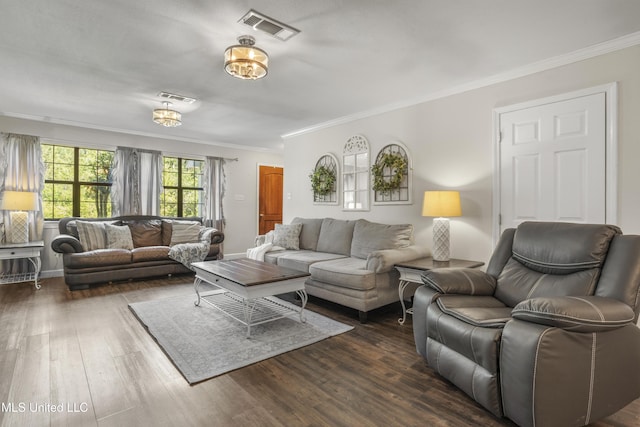 living area with visible vents, ornamental molding, and dark wood finished floors