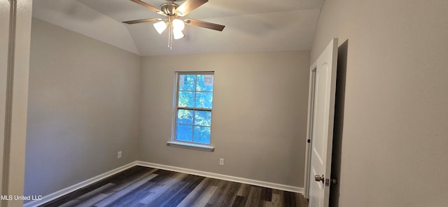 unfurnished room featuring lofted ceiling, ceiling fan, and dark hardwood / wood-style flooring