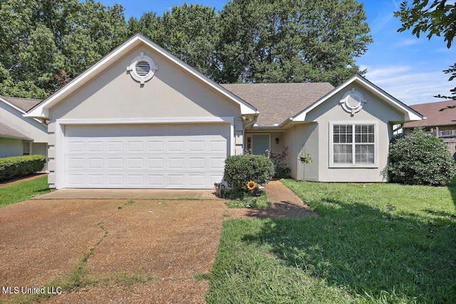 ranch-style house featuring a front lawn and a garage