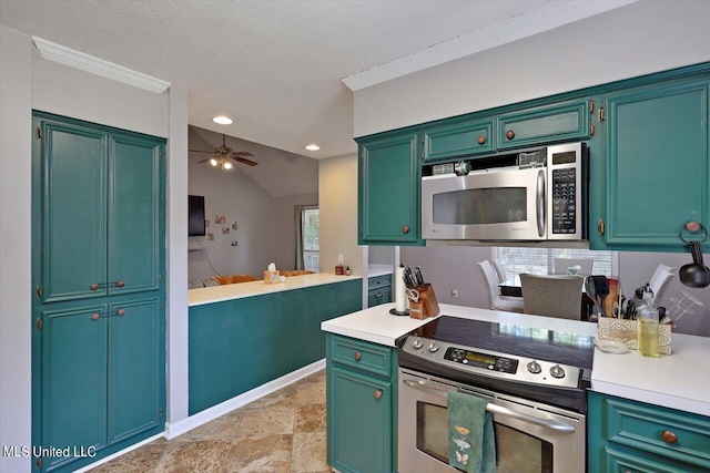 kitchen featuring ceiling fan, appliances with stainless steel finishes, a textured ceiling, vaulted ceiling, and crown molding