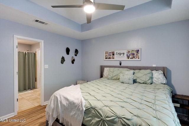 bedroom featuring hardwood / wood-style floors and ceiling fan