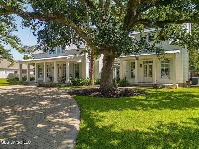 view of front of home featuring a porch, central AC, and a front lawn