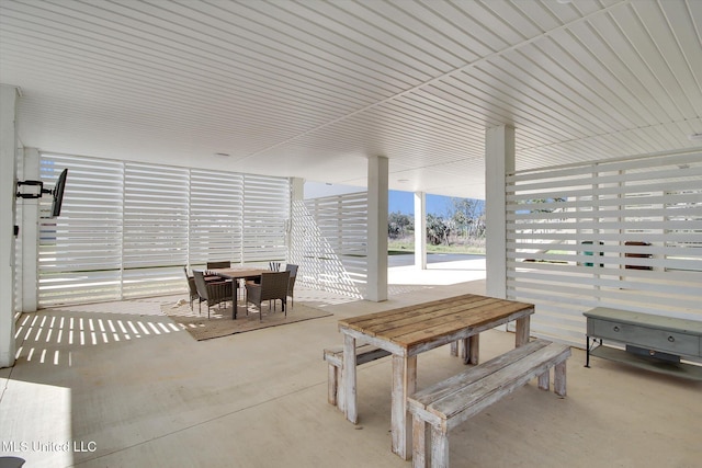 view of patio featuring outdoor dining area