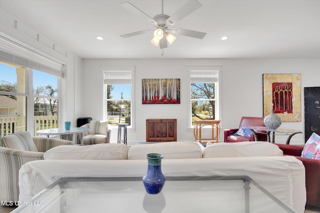 living room with a wealth of natural light and recessed lighting