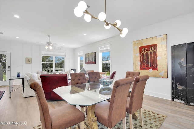 dining space with light wood finished floors, recessed lighting, a ceiling fan, and baseboards