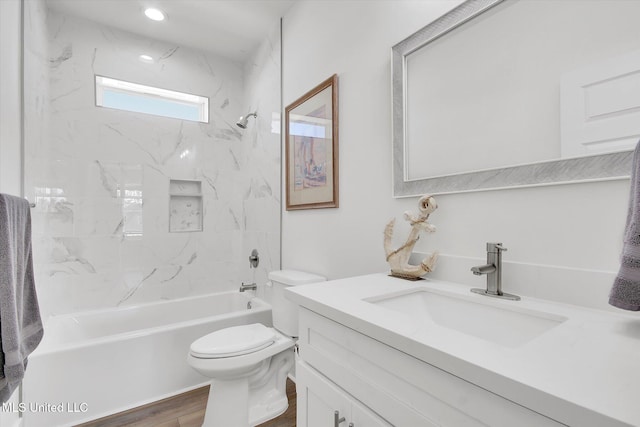 full bathroom with vanity, shower / tub combination, toilet, and wood finished floors