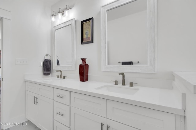 bathroom with a sink and double vanity