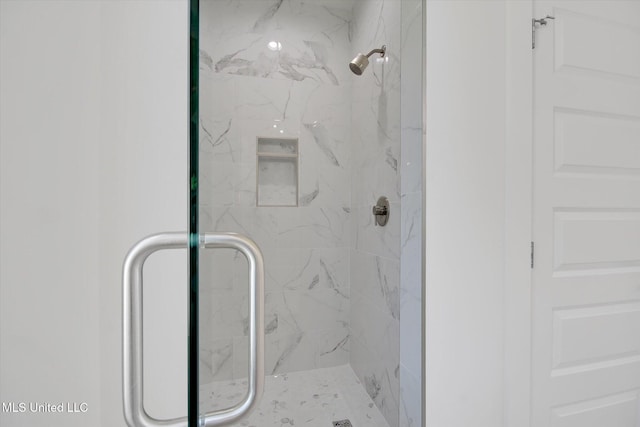 full bath featuring a shower stall