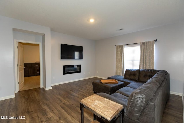 living room with dark hardwood / wood-style floors