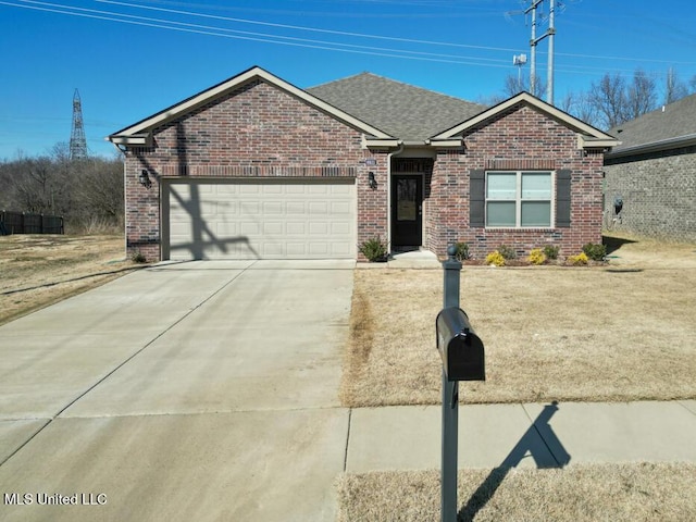 view of front of property with a front lawn and a garage