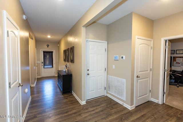 corridor with dark wood-type flooring