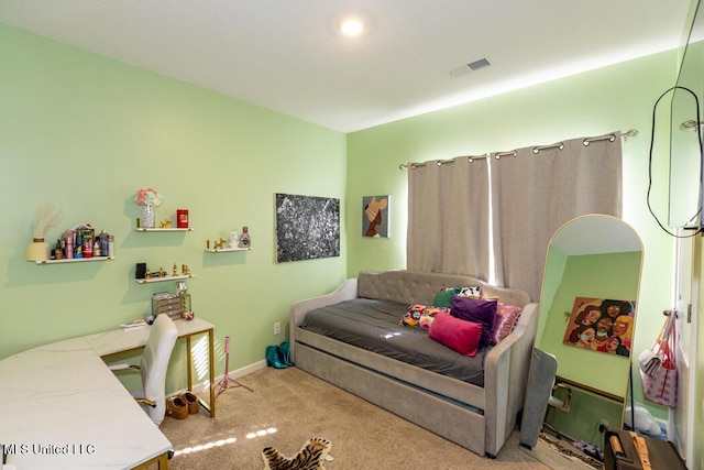 bedroom featuring light carpet