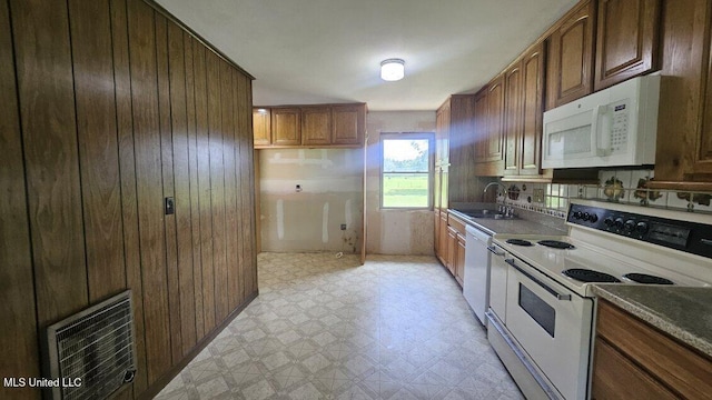 210 Ford St, Como, MS 38619 - kitchen with white appliances, light floors, and wood walls