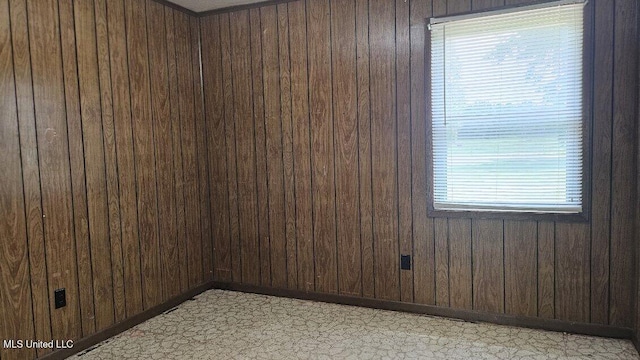 210 Ford St, Como, MS 38619 - spare room featuring wood walls