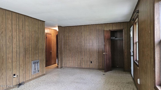 210 Ford St, Como, MS 38619 - unfurnished room featuring wooden walls and light carpet