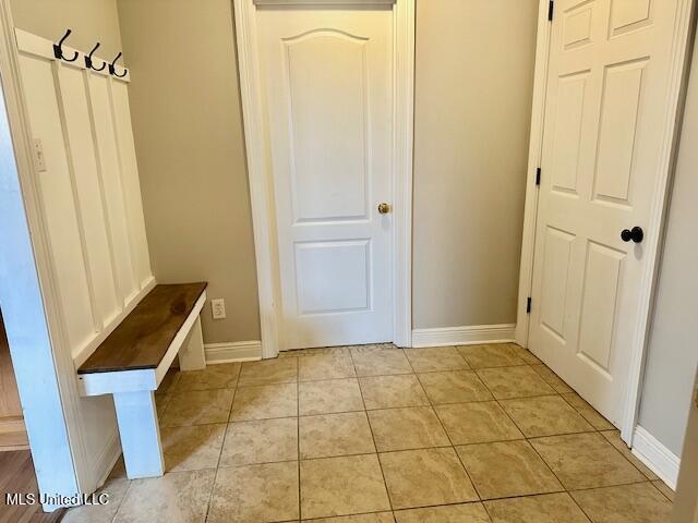 mudroom with light tile patterned floors