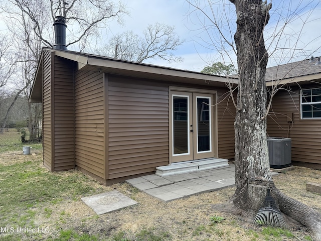 exterior space featuring french doors and central air condition unit