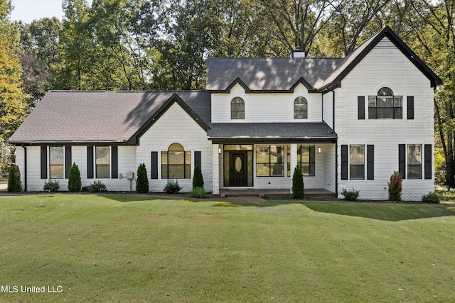 view of front of house featuring a porch and a front yard