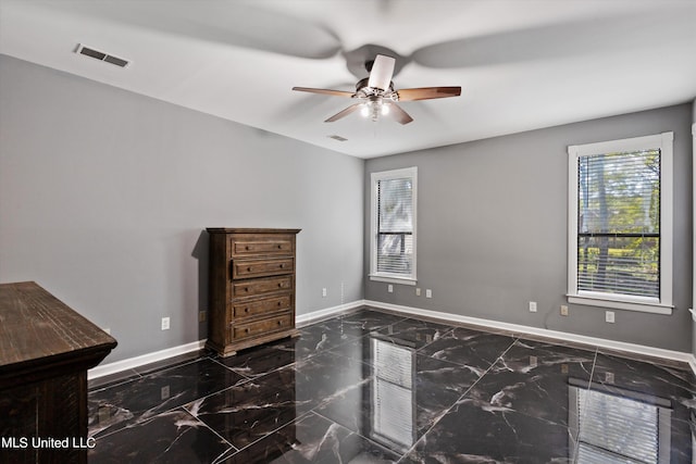 unfurnished bedroom featuring ceiling fan