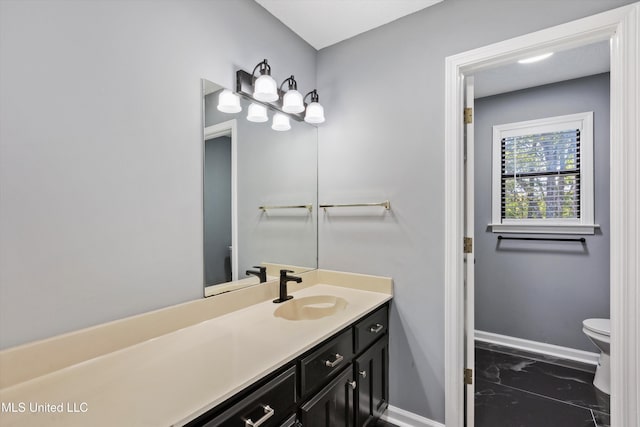 3555 Bonner Dr, Olive Branch, MS 38654 - bathroom featuring toilet, marble finish floor, vanity, and baseboards