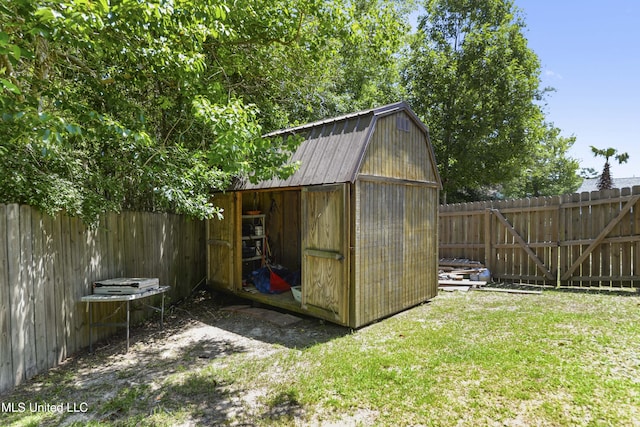 view of shed with a fenced backyard