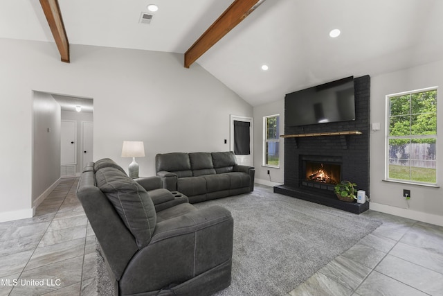 living room featuring visible vents, lofted ceiling with beams, baseboards, and a wealth of natural light