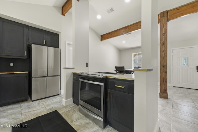 kitchen with dark cabinetry, baseboards, appliances with stainless steel finishes, and beamed ceiling